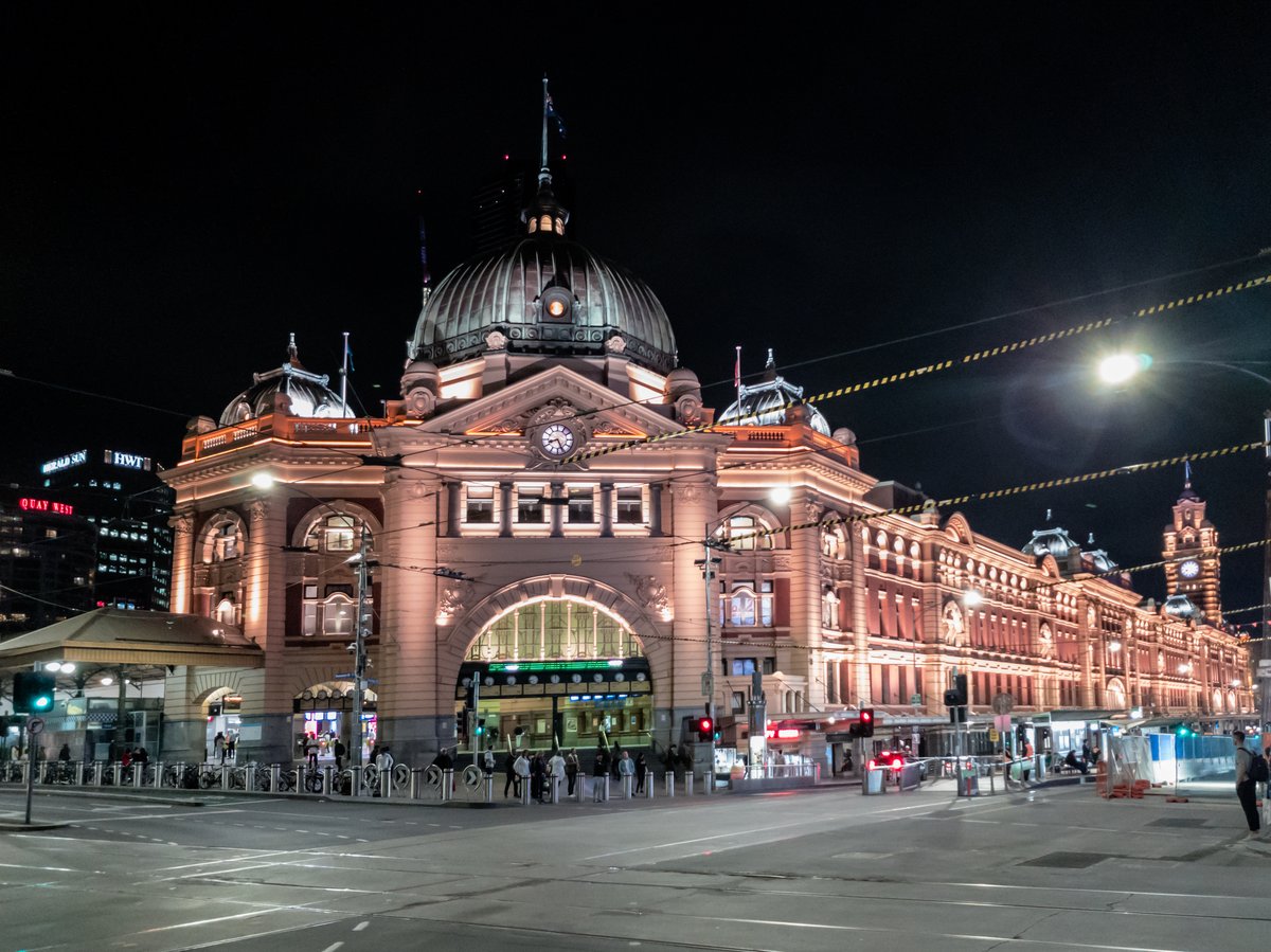Yarra River promenade with historic Melbourne bridges and riverside cafes